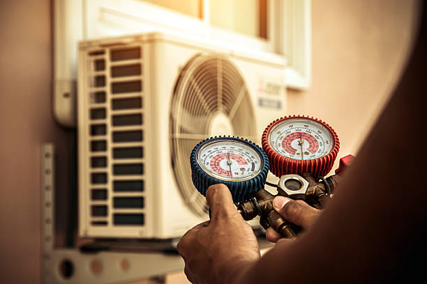 Professional Hvac technician working in Huletts Landing, NY
